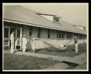 Natives Bringing Patient To Fordlandia Hospital, Brazil, 1931 — Ford Motor Company. Photographic Department
