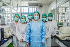 Dr Pilailuk Okada (centre), Head Of The Thai National Influenza Centre At The National Institute Of Health, And Her Team Of Microbiologists — Ploy Phutpheng
