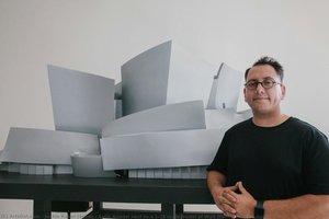 Refik Anadol Next To A 1:25 Scale Model Of Walt Disney Concert Hall. — Jackie Russo Jaquez