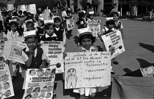 Schoolchildren March Through The Streets In Mexico Carrying Banners In Favour Of Immunization — Liba Taylor-klug