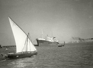 An Image Of A Cruise Ship And A Number Of Sailing Vessels, In The Waters Off The Coast Of Karachi. Circa. 1940s. — The Citizens Archive Of Pakistan