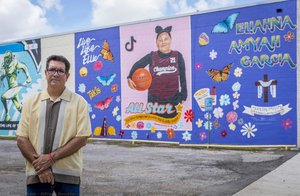 Muralist In Front Of Portrait Mural Of Eliahna — Alfredo Rendón