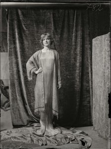 Model Wearing A Delphos Dress And Printed Silk Tunic — Mariano Fortuny