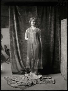 Model Wearing A Delphos Dress And Printed Silk Tunic — Mariano Fortuny