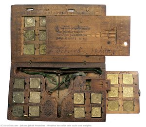 Wooden box with coin scale and weights