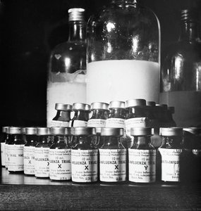 Close-up Of A Vaccine Used In Previous Trial For Developing Satisfactory Production Techniques. In Background Can Be Seen The Stock Solution — Éric Schwab